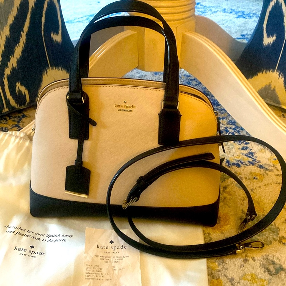 Kate Spade Lottie- crossbody strap & handle to carry.